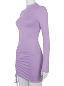 black turtleneck bodycon mini dress showcased on a mannequin in a stylish pose, highlighting its chic design.