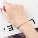 Women's Fashion Simple Irregular Bracelet worn on a hand, showcasing its elegant gold design.